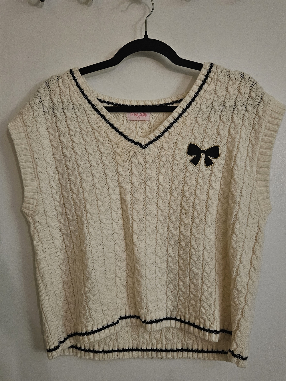 Pink Lily Cream Cable Knit V-Neck Sweater Vest with Black Trim & Bow Accent